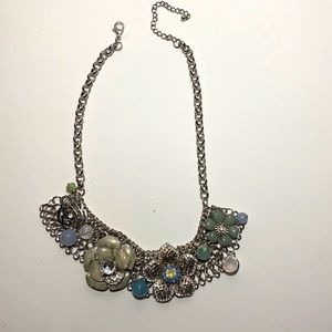 Adorable silver colored knuckles with green light aqua beading.